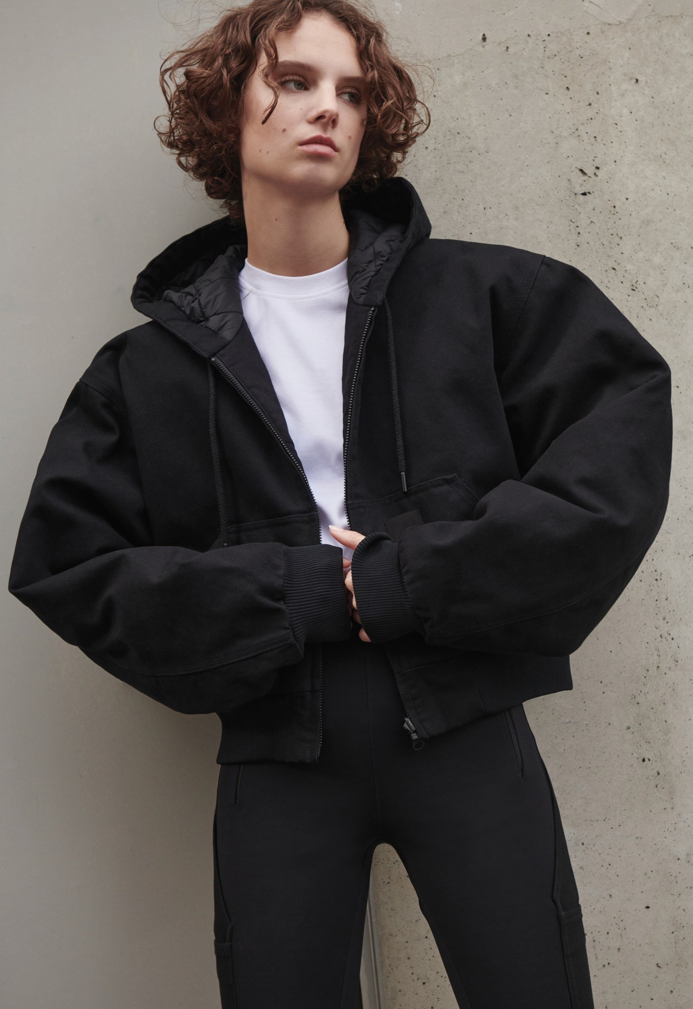 A model wearing elegant all black workwear