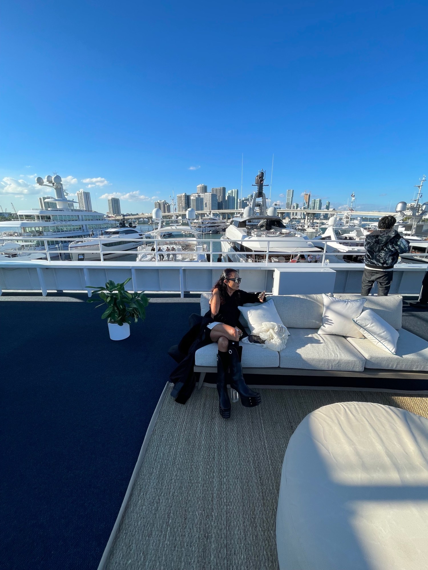 Michele Lamy sitting on a sunny rooftop