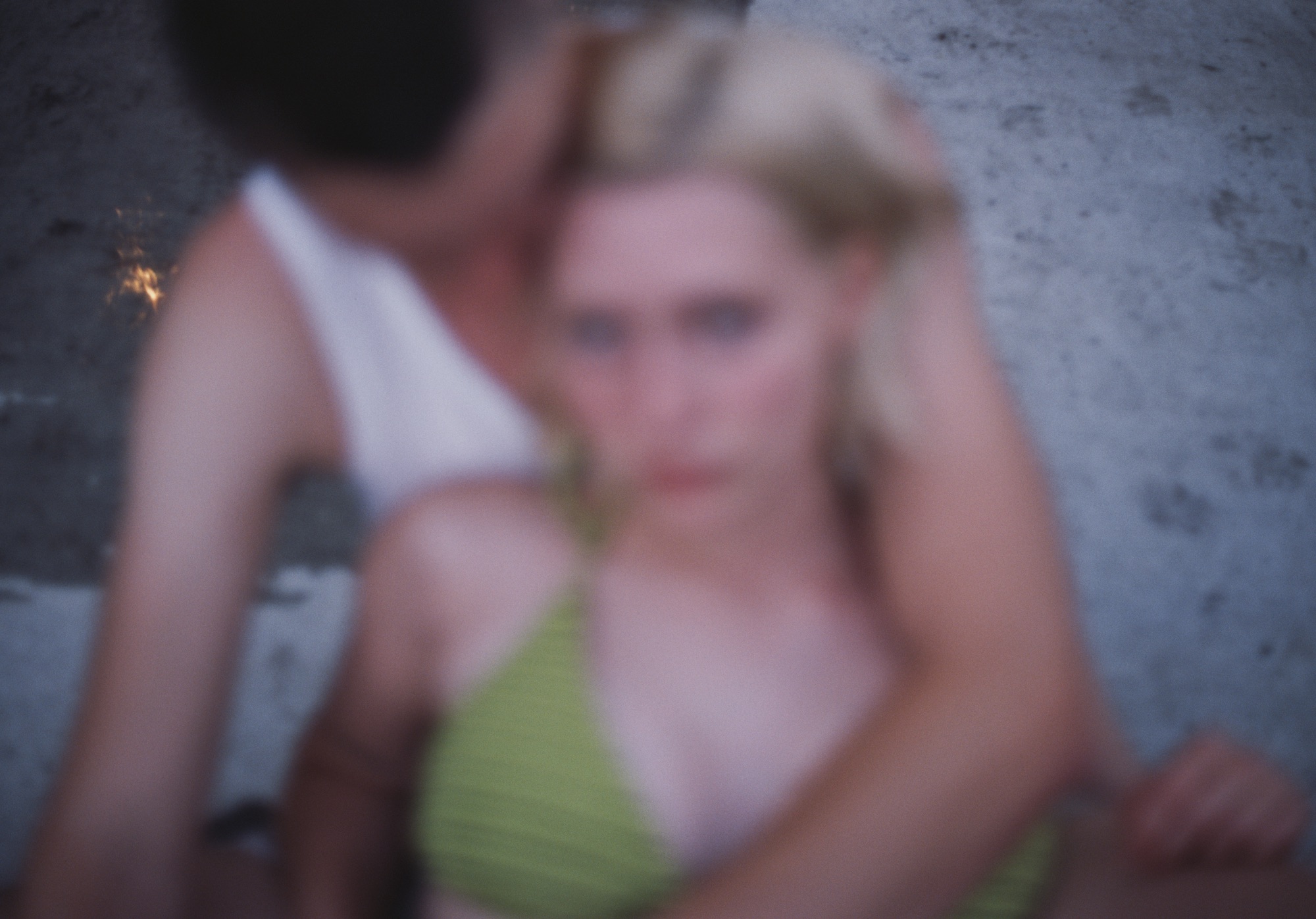 a blurry photo of a couple embracing in summertime by kerstii jan werdal