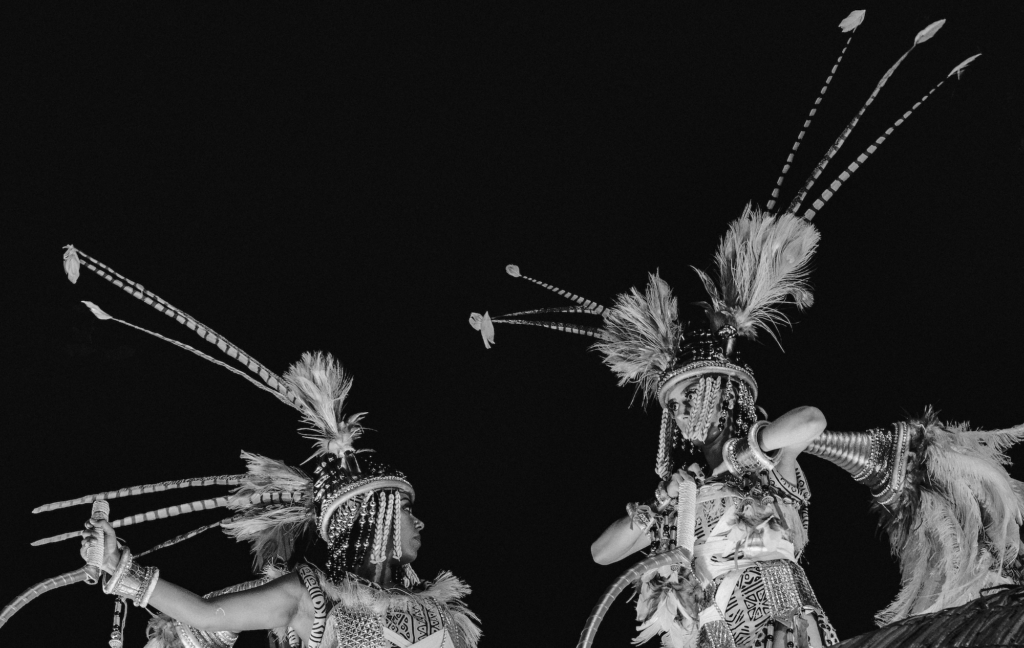 two carnival performers in headdresses and full costume by ibrahem hasan