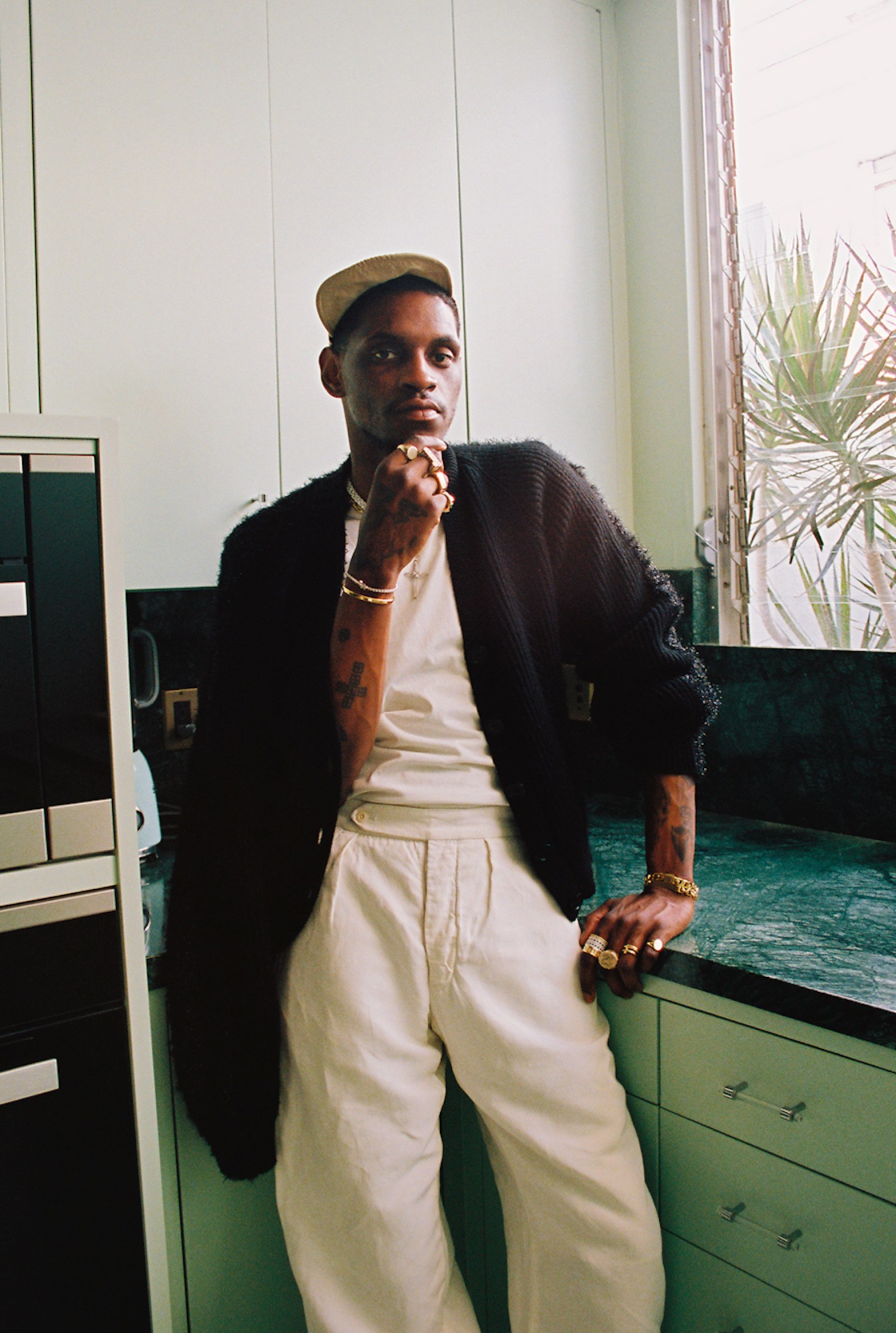 A$AP Nast leaning against the kitchen table photographed by Bladimir Corniel