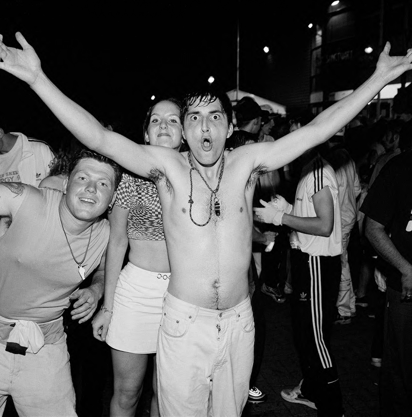 a photograph of people at a rave in the 90s