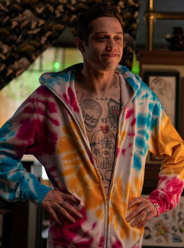 pete davidson wearing a tie dye sweatshirt unzipped in the king of staten island