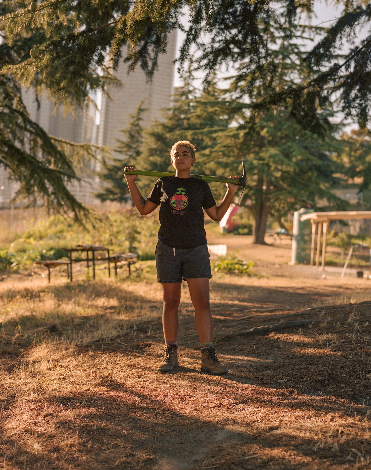 hannah wilson holding an axe on the farm