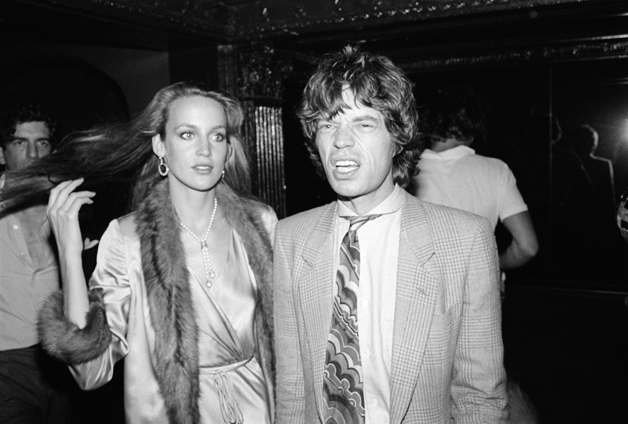 jerry hall flipping her hair in a fur lined jacket with mick jagger at studio 54