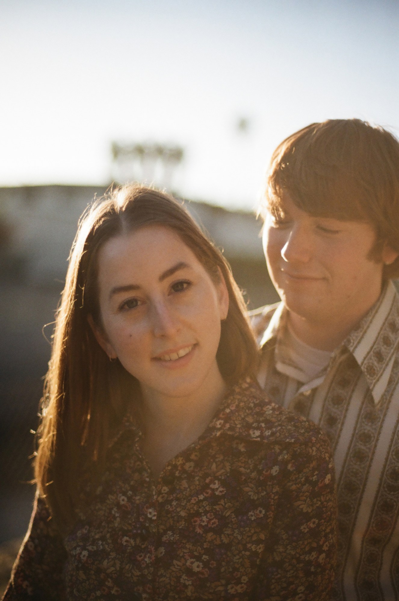 haim and hoffman pose together at golden hour