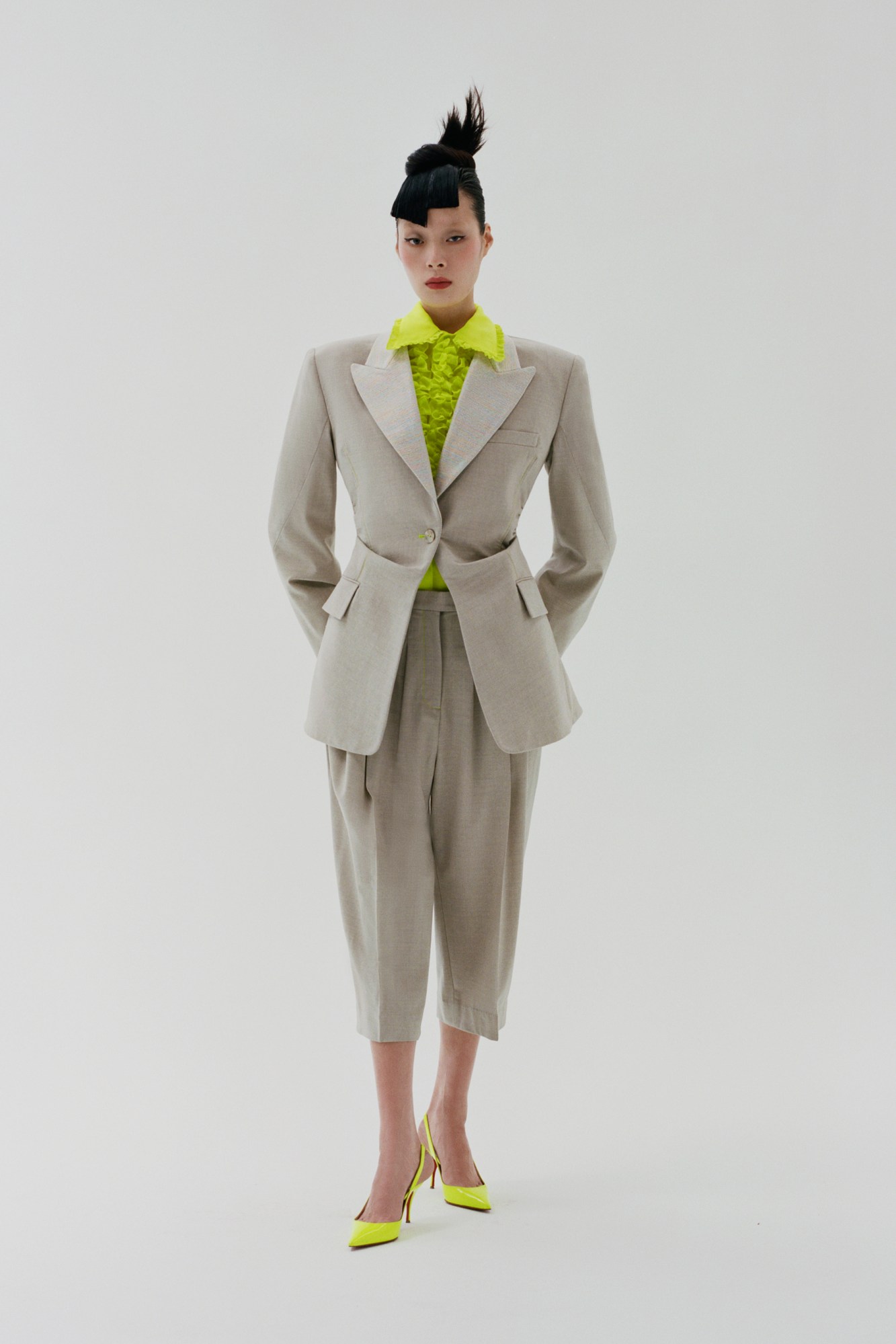 A model wearing a suit by Christopher John Rogers