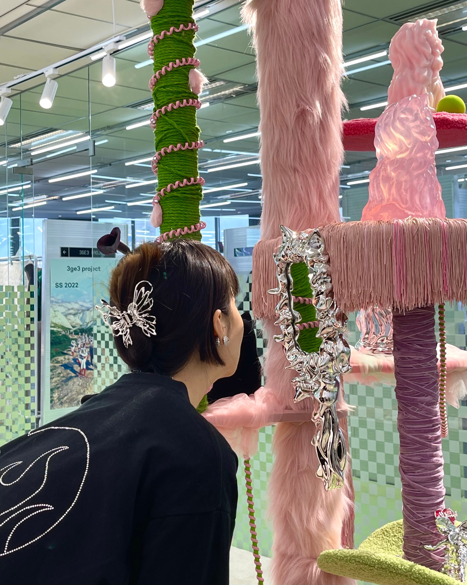 a girl looking in a mirror wearing a silver butterfly hair piece by yvmin