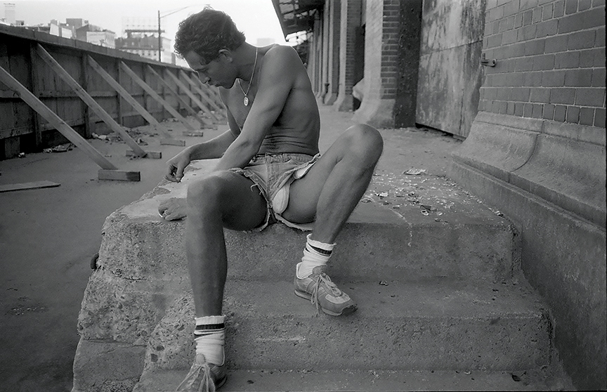 a man in revealing denim shorts at christopher street pier 1970s