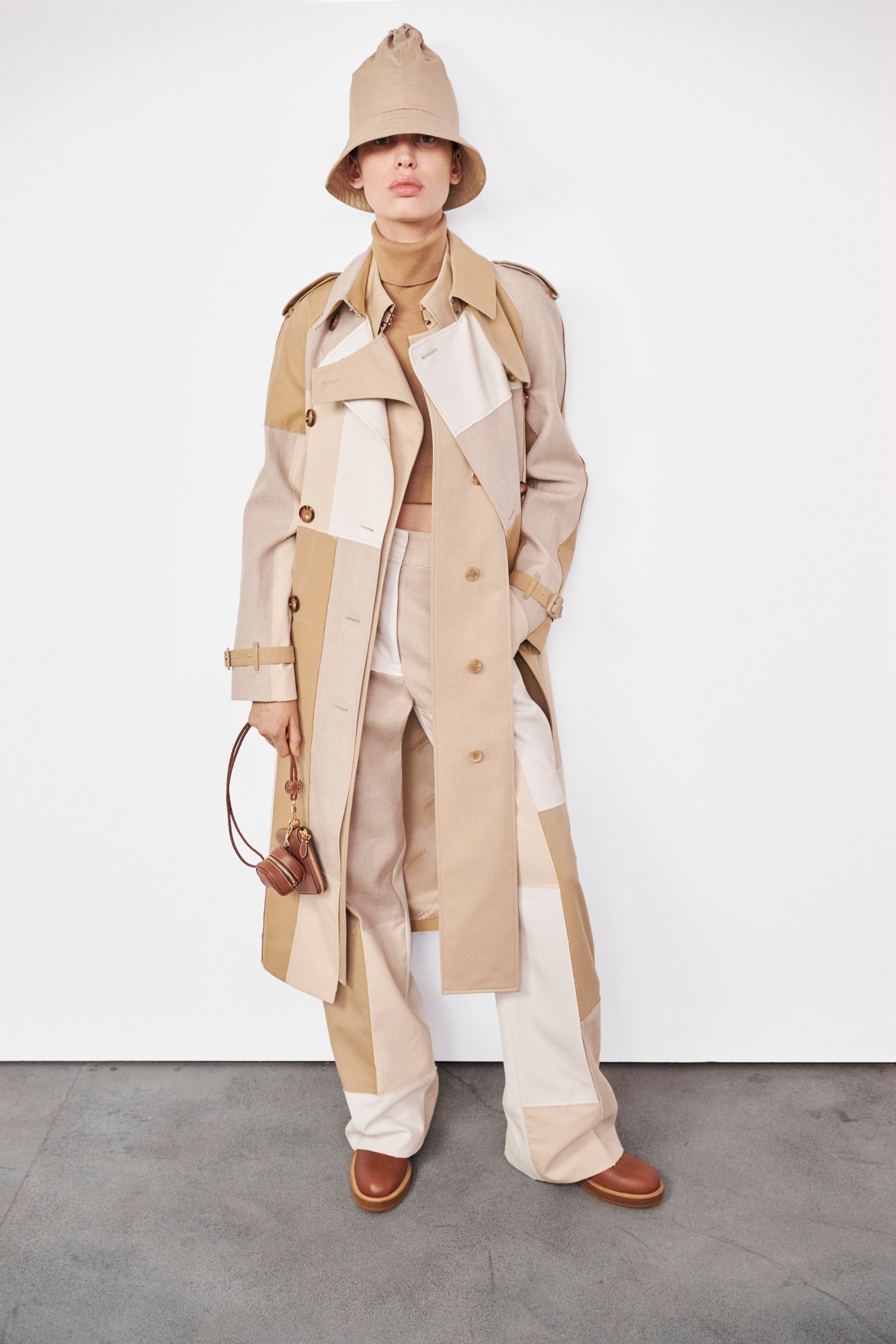 Model wearing patchwork trench Burberry's AW22 precollection