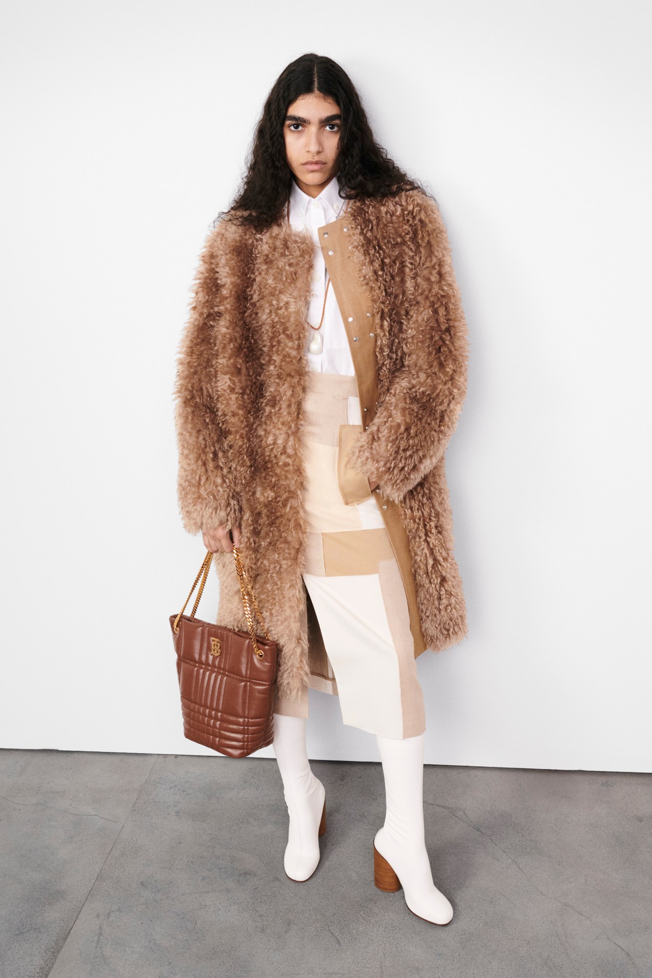 Models wearing faux fur jacket Burberry's AW22 precollection