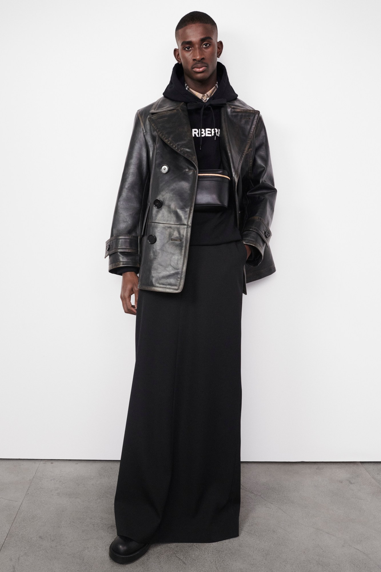 Model wearing black leather jacket and long skirt Burberry's AW22 precollection