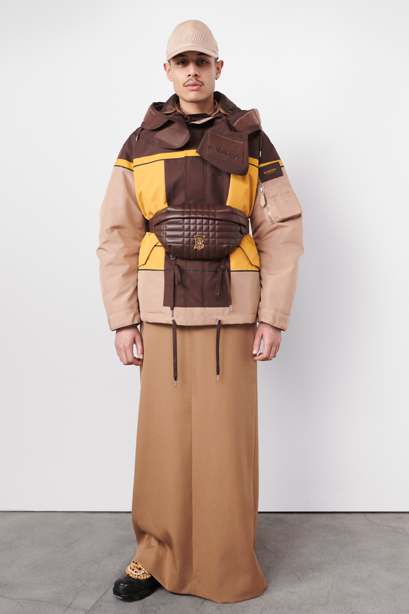 Model wearing ski jacket in beige Burberry's AW22 precollection