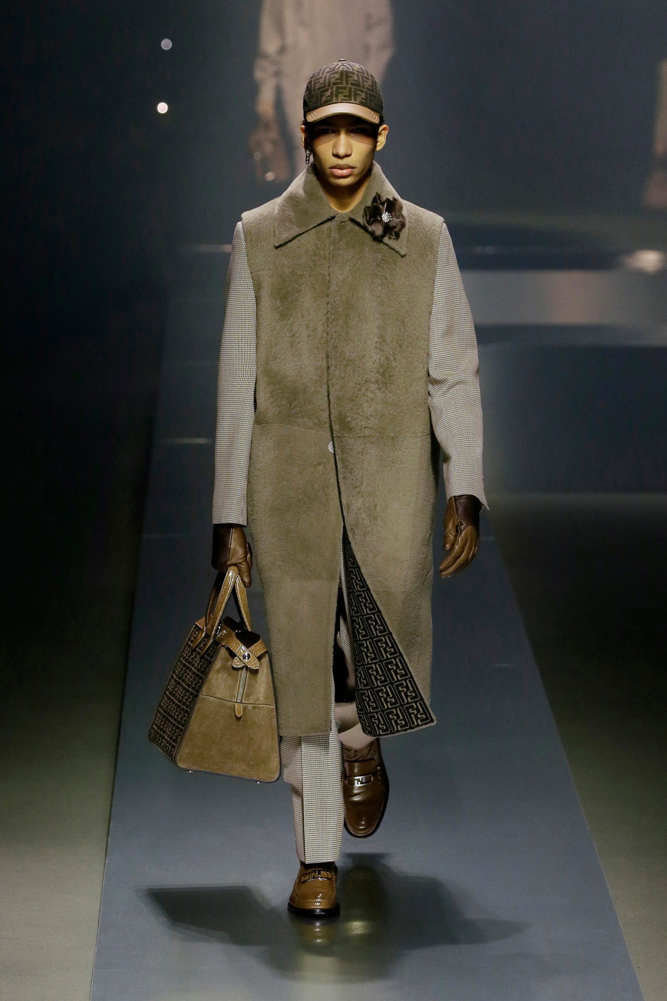 A model walking the runway at Fendi AW22