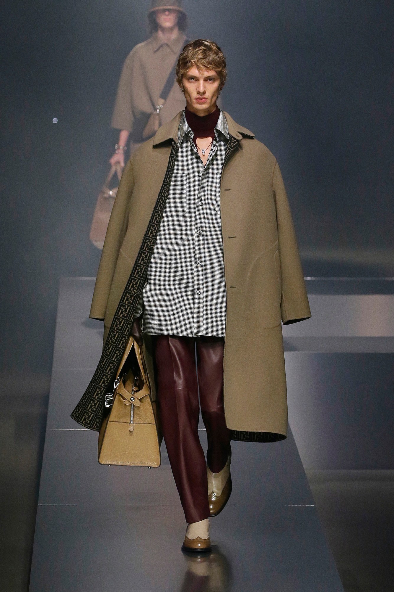 A model walking the runway at Fendi AW22