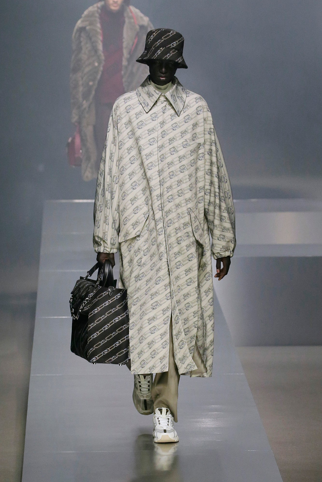 A model walking the runway at Fendi AW22