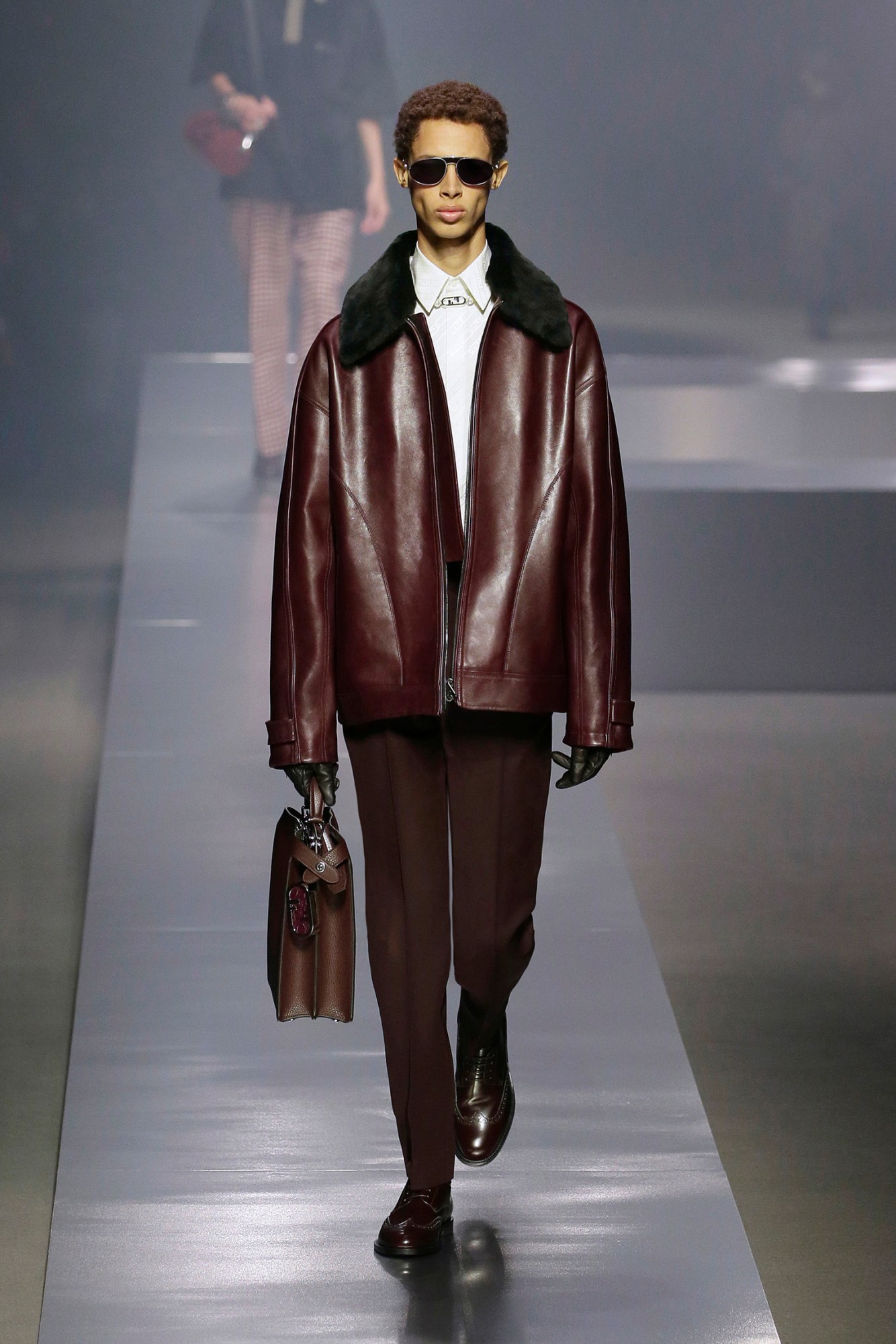 A model walking the runway at Fendi AW22