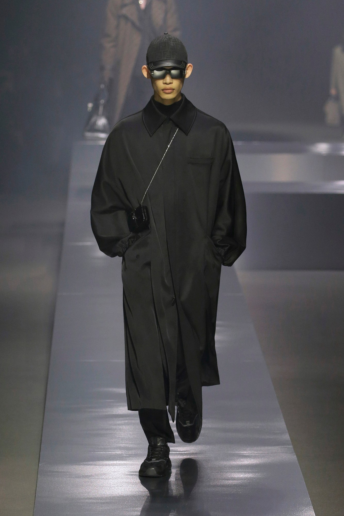 A model walking the runway at Fendi AW22