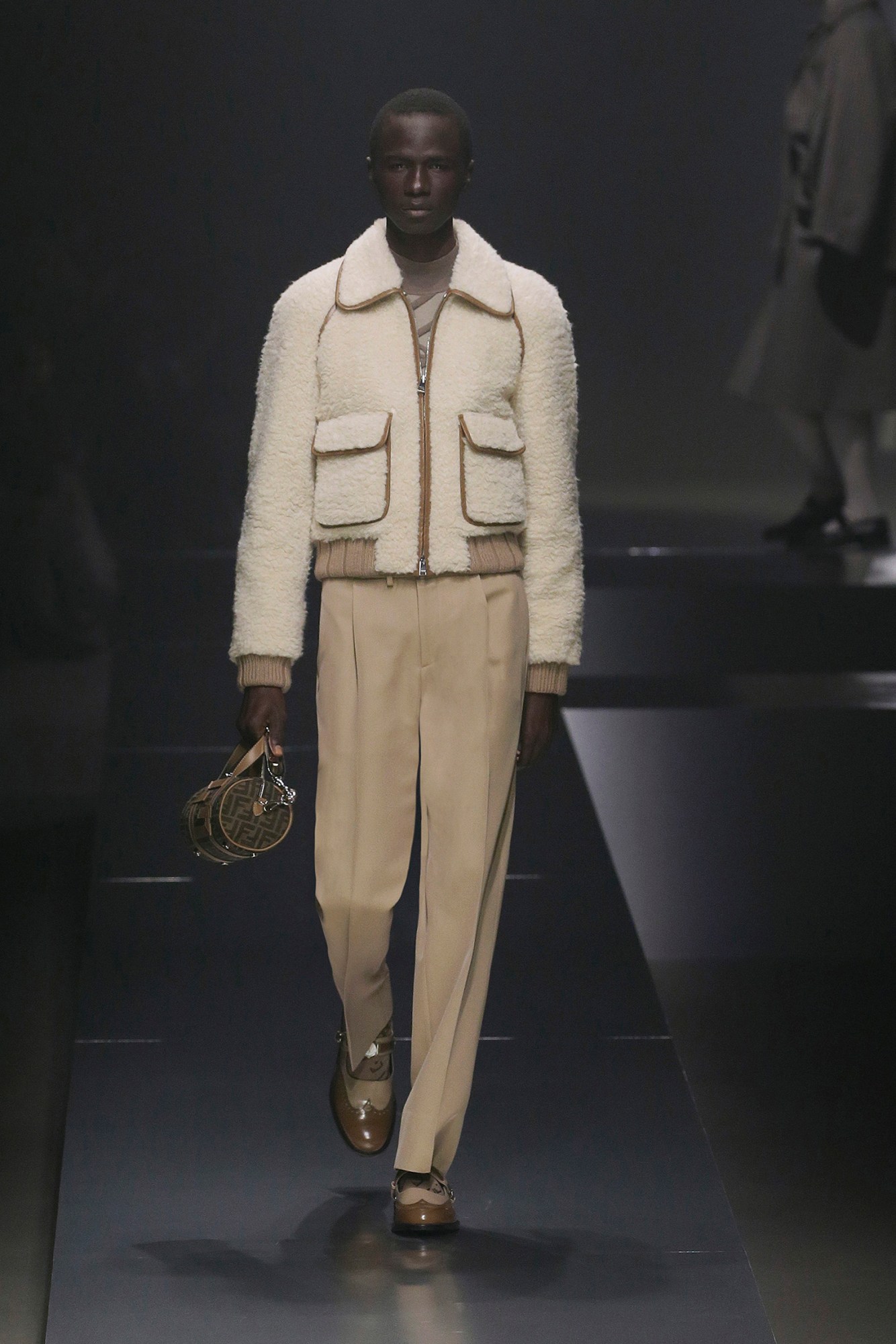 A model walking the runway at Fendi AW22