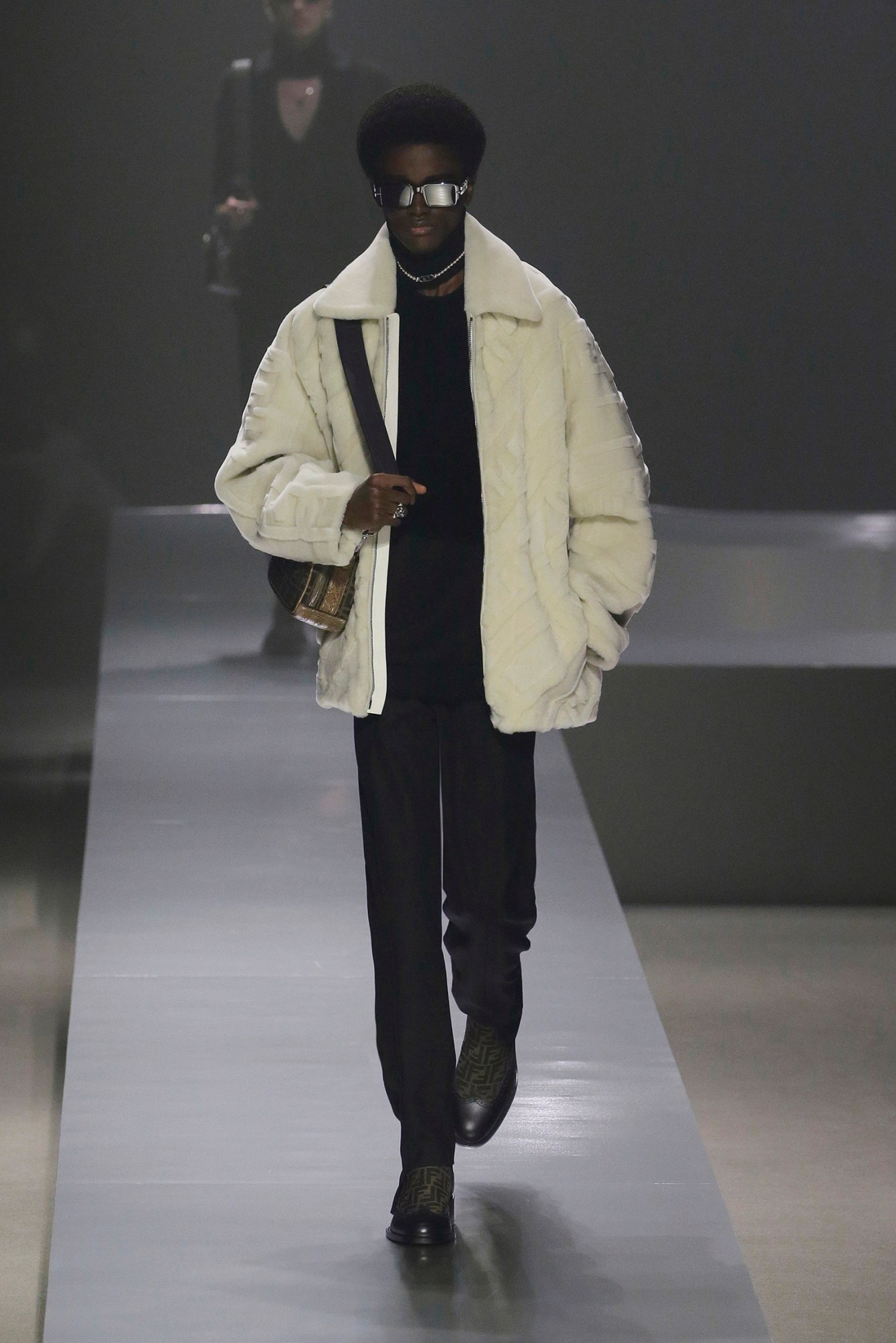 A model walking the runway at Fendi AW22