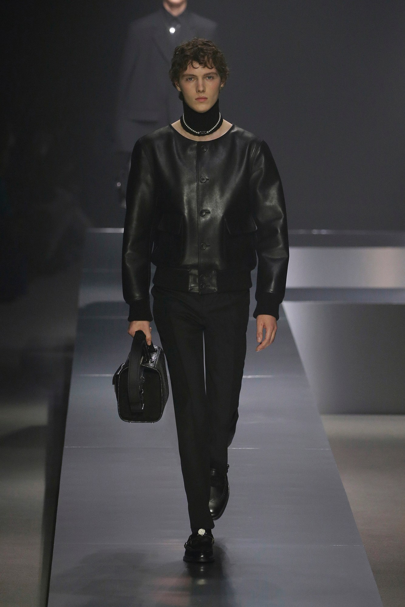 A model walking the runway at Fendi AW22