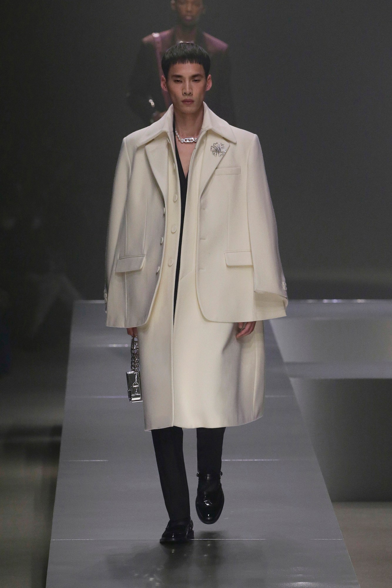 A model walking the runway at Fendi AW22