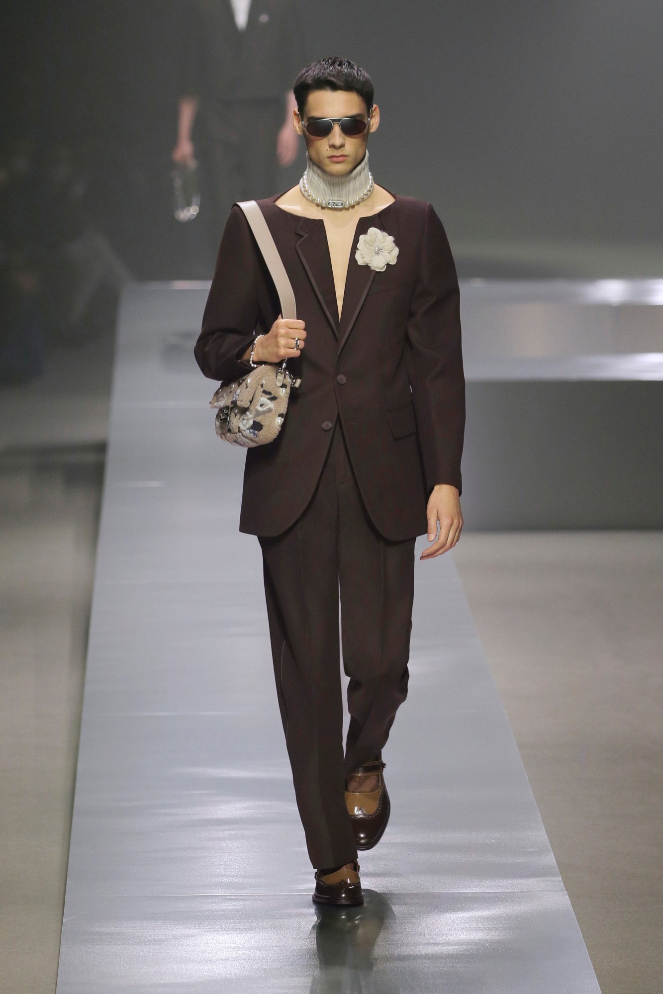 A model walking the runway at Fendi AW22