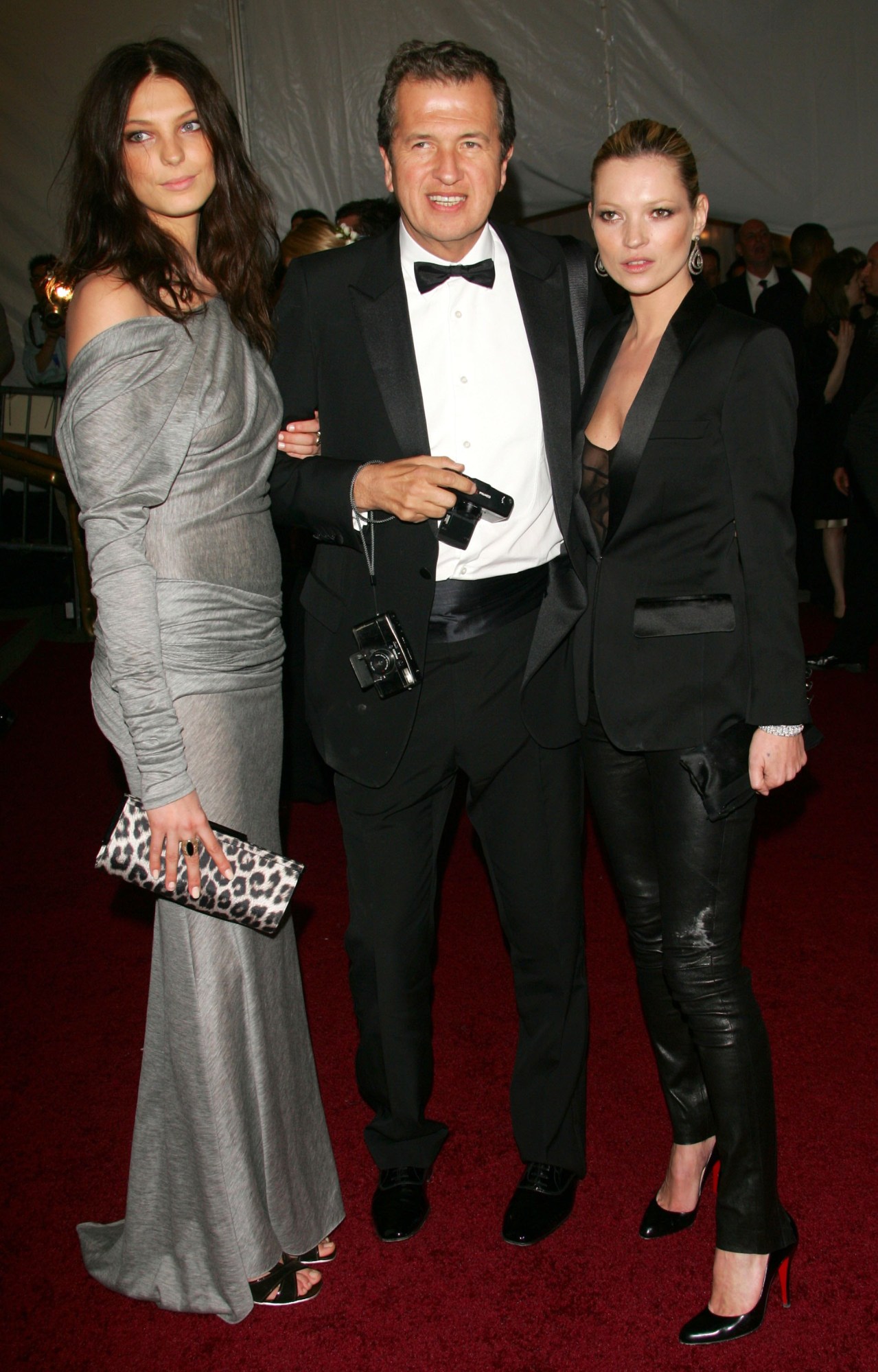 kate moss posing at the met gala in skinny leather pants and louboutins 2006