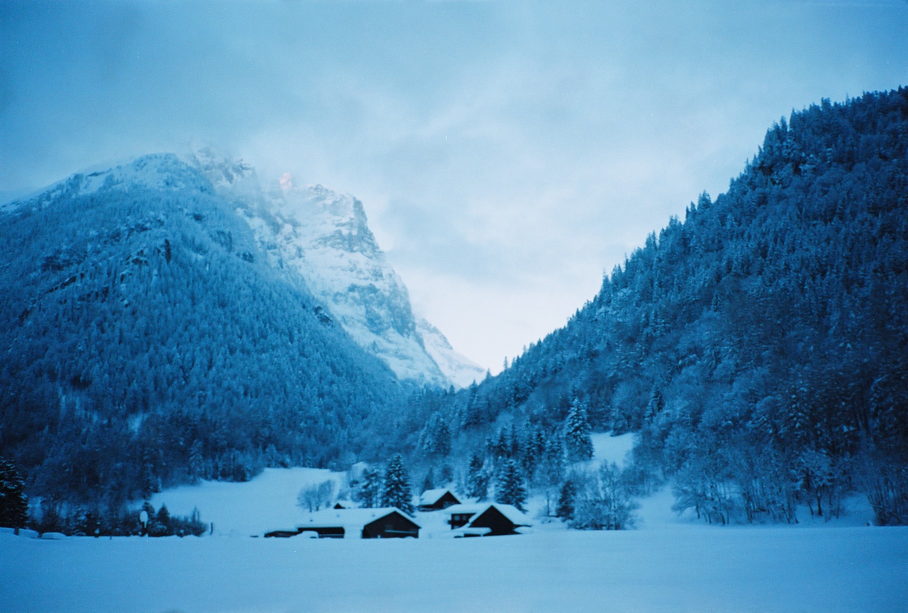 An image of snow-covered chalets