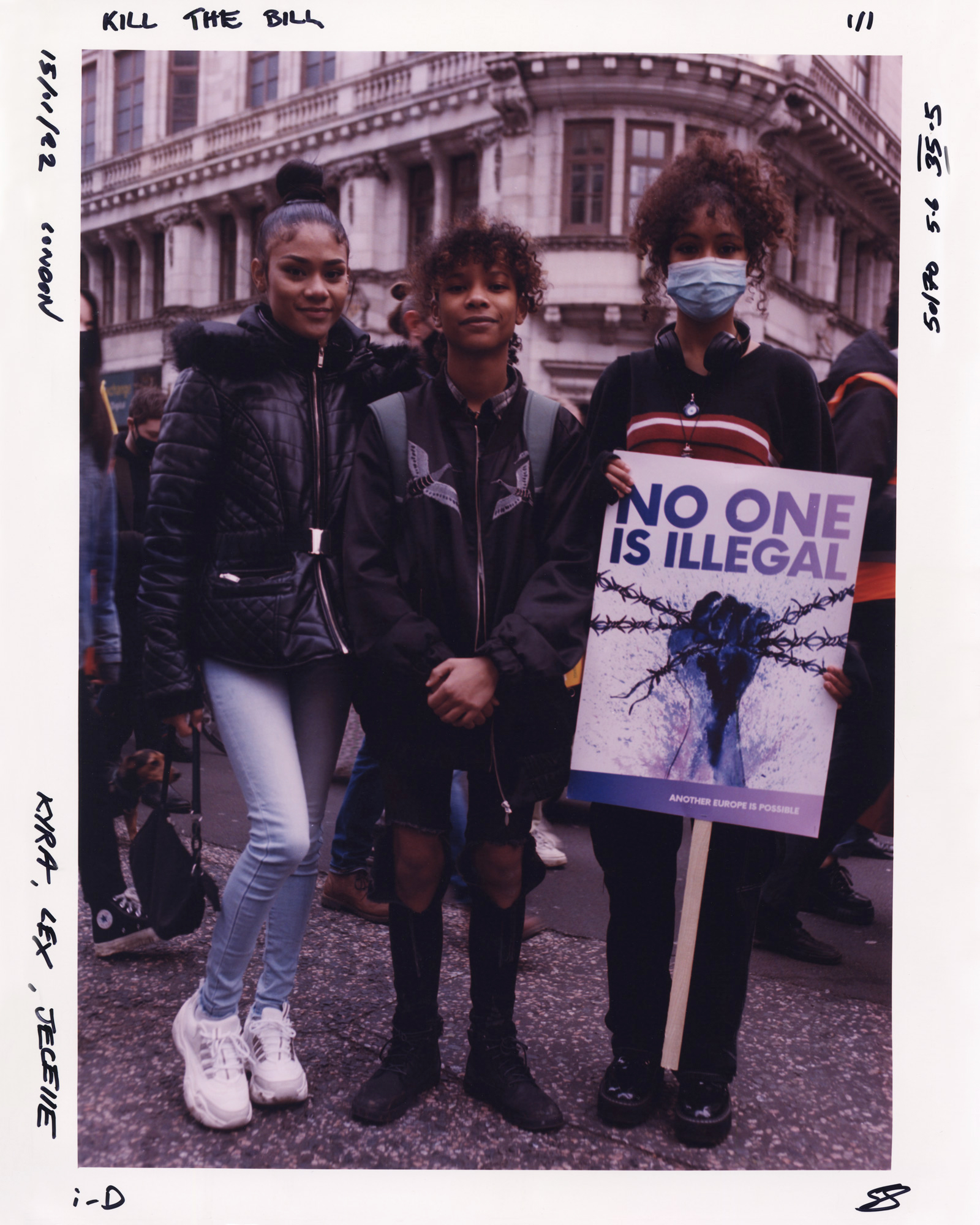 Three protesters at the Kill the Bill protest, one holding a sign saying No one is illegal