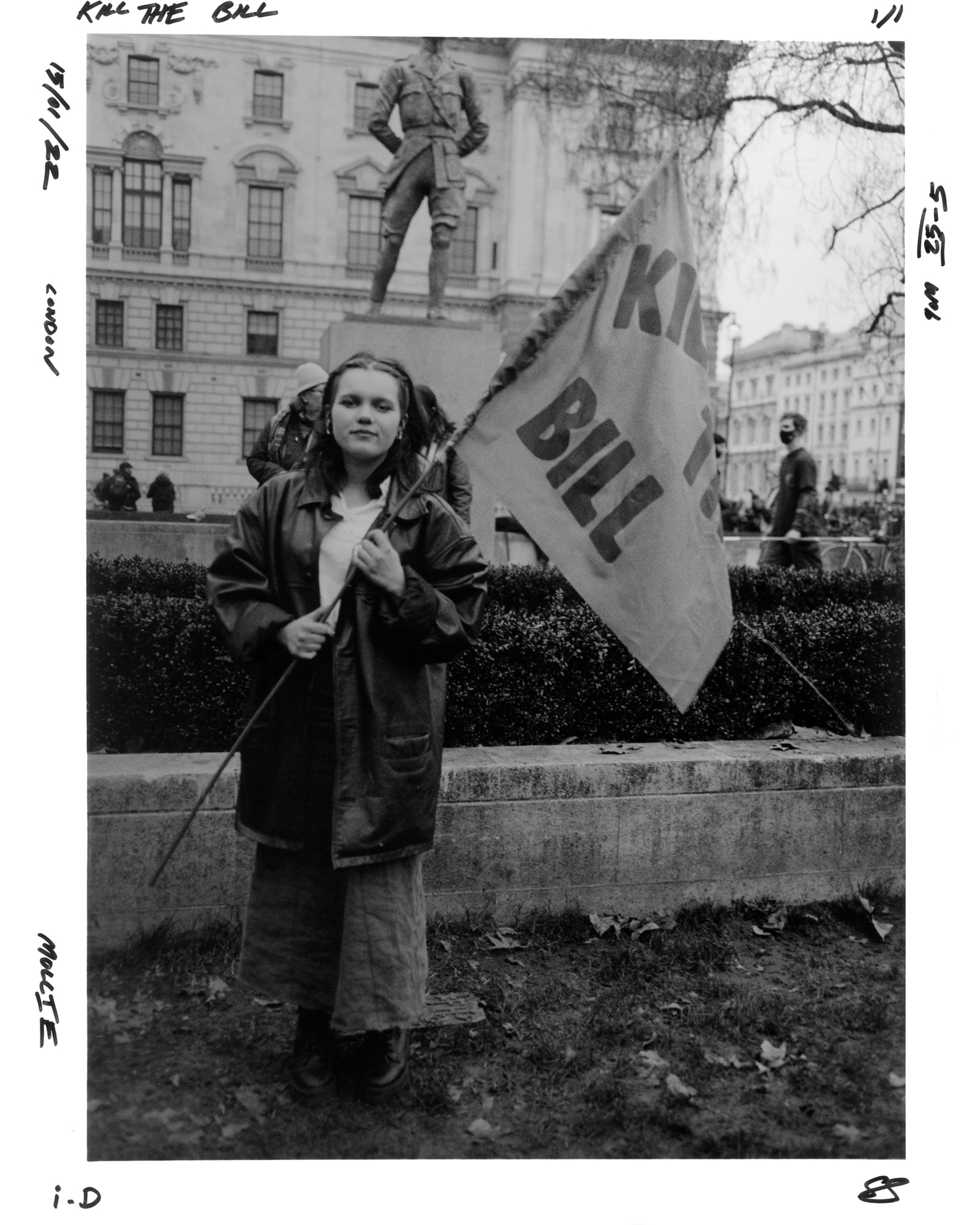 Protester holding a flag saying kill the bill at the Kill the Bill protest