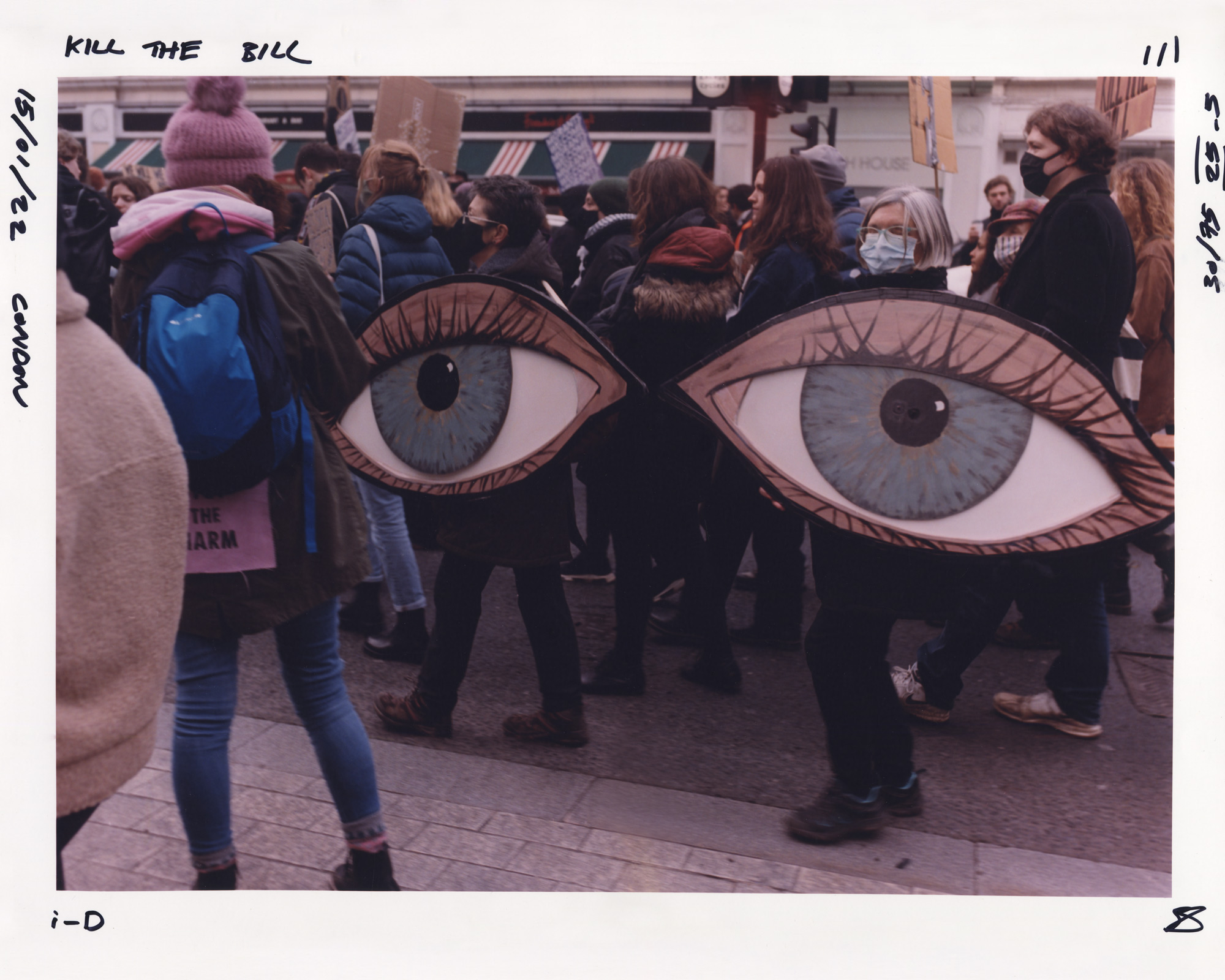 Protesters holding painted eye signs at the Kill the Bill protest