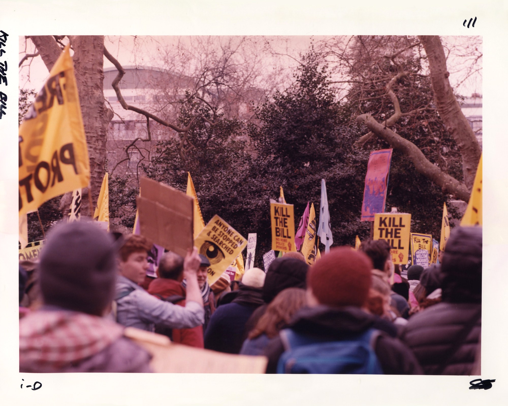 Protesters with yellow kill the bill signs at the Kill the Bill protest