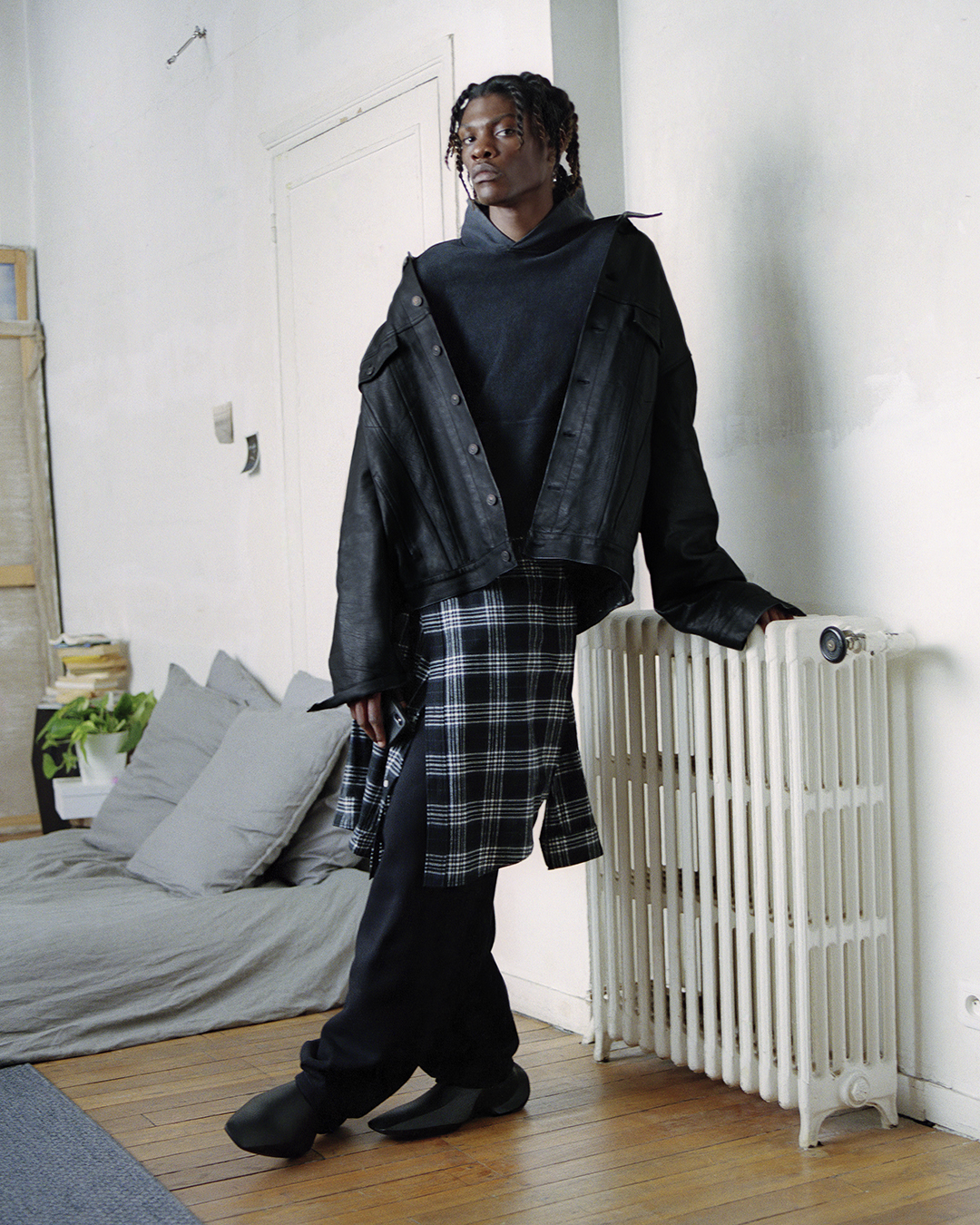 Tommy Blue wearing Balenciaga in his home.