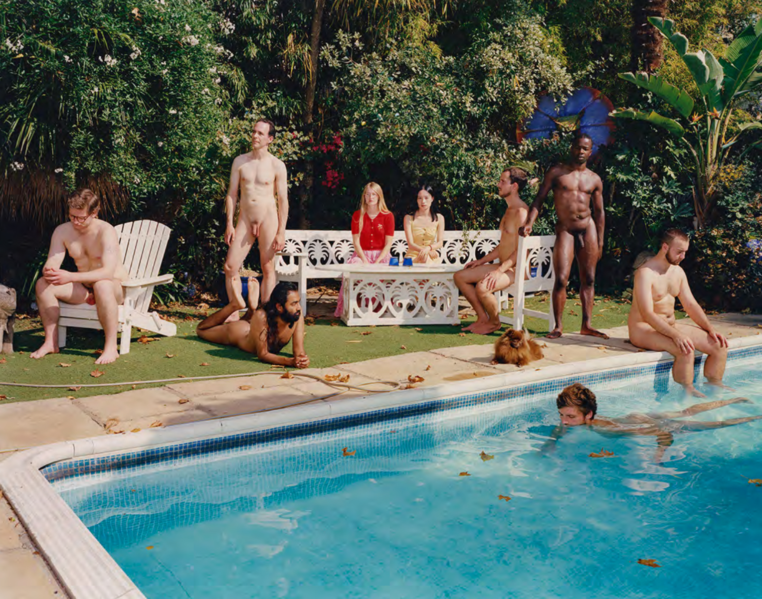 a group of people nude around a swimming pool