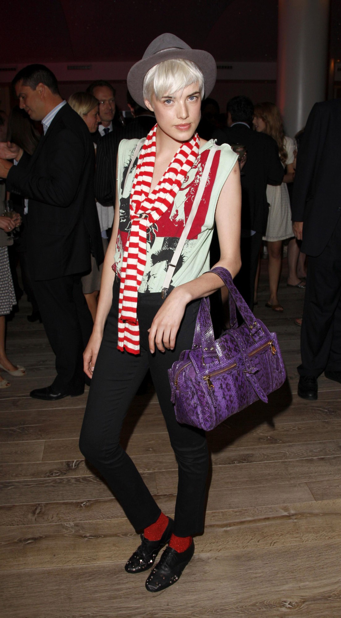 agyness deyn wearing a graphic tee, skinny jeans and suspenders at the british fashion council's fashion forward party 2007