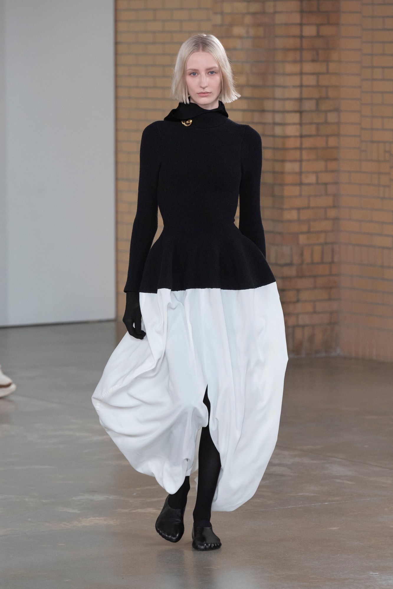 a model wearing proenza schouler's aw22 collection