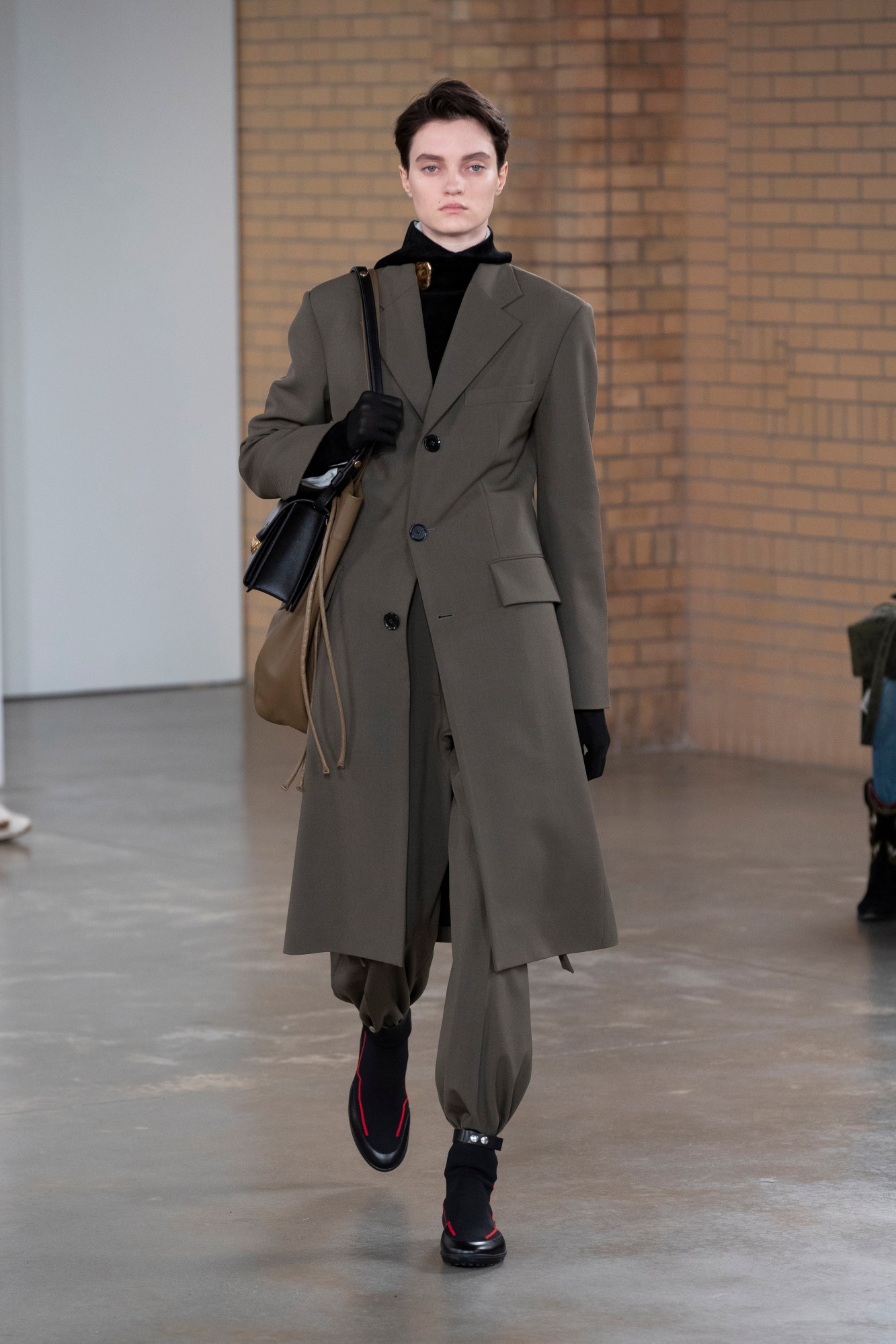 a model wearing proenza schouler's aw22 collection