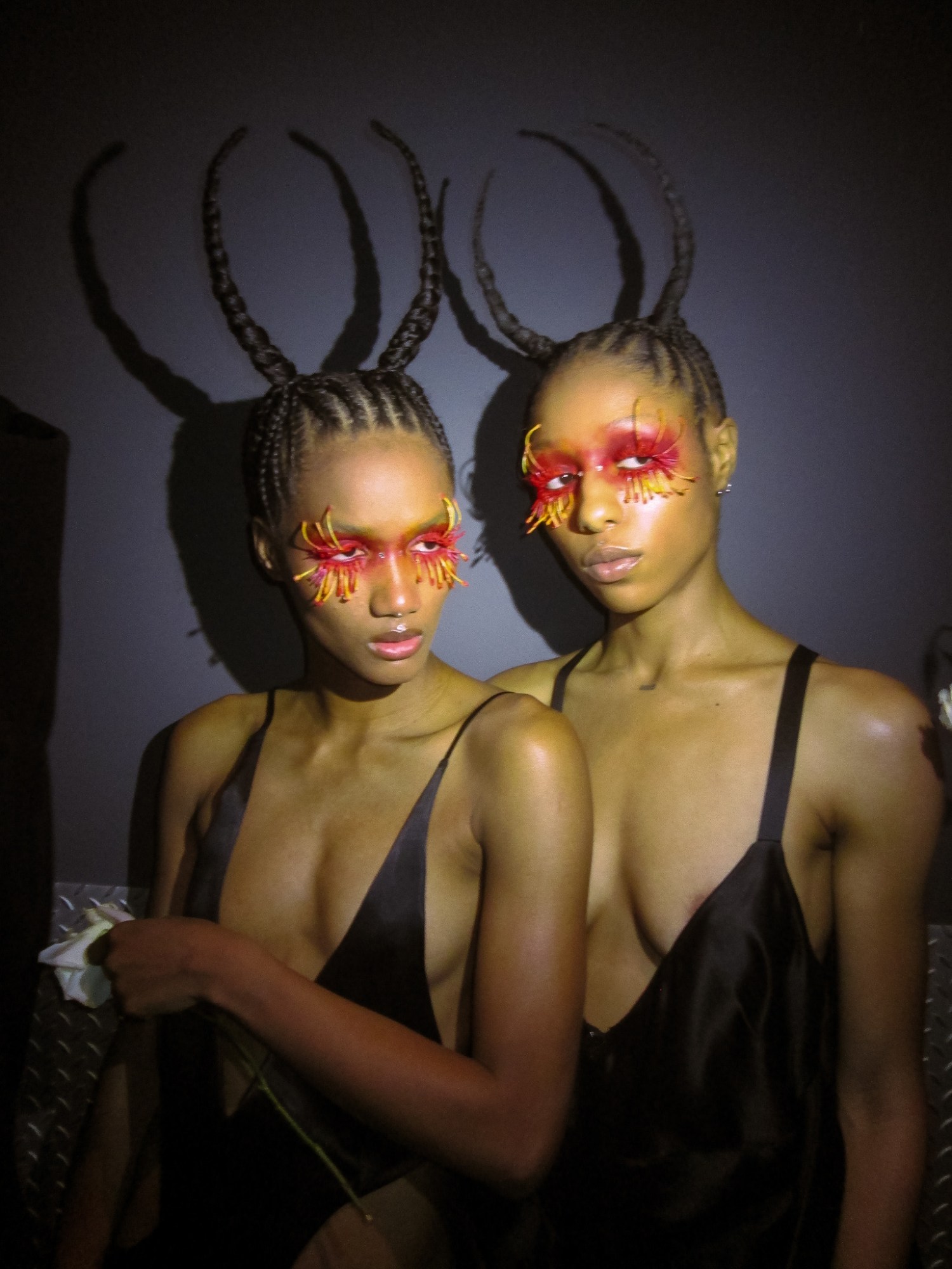 two models posing backstage at shayne oliver's new york fashion week event