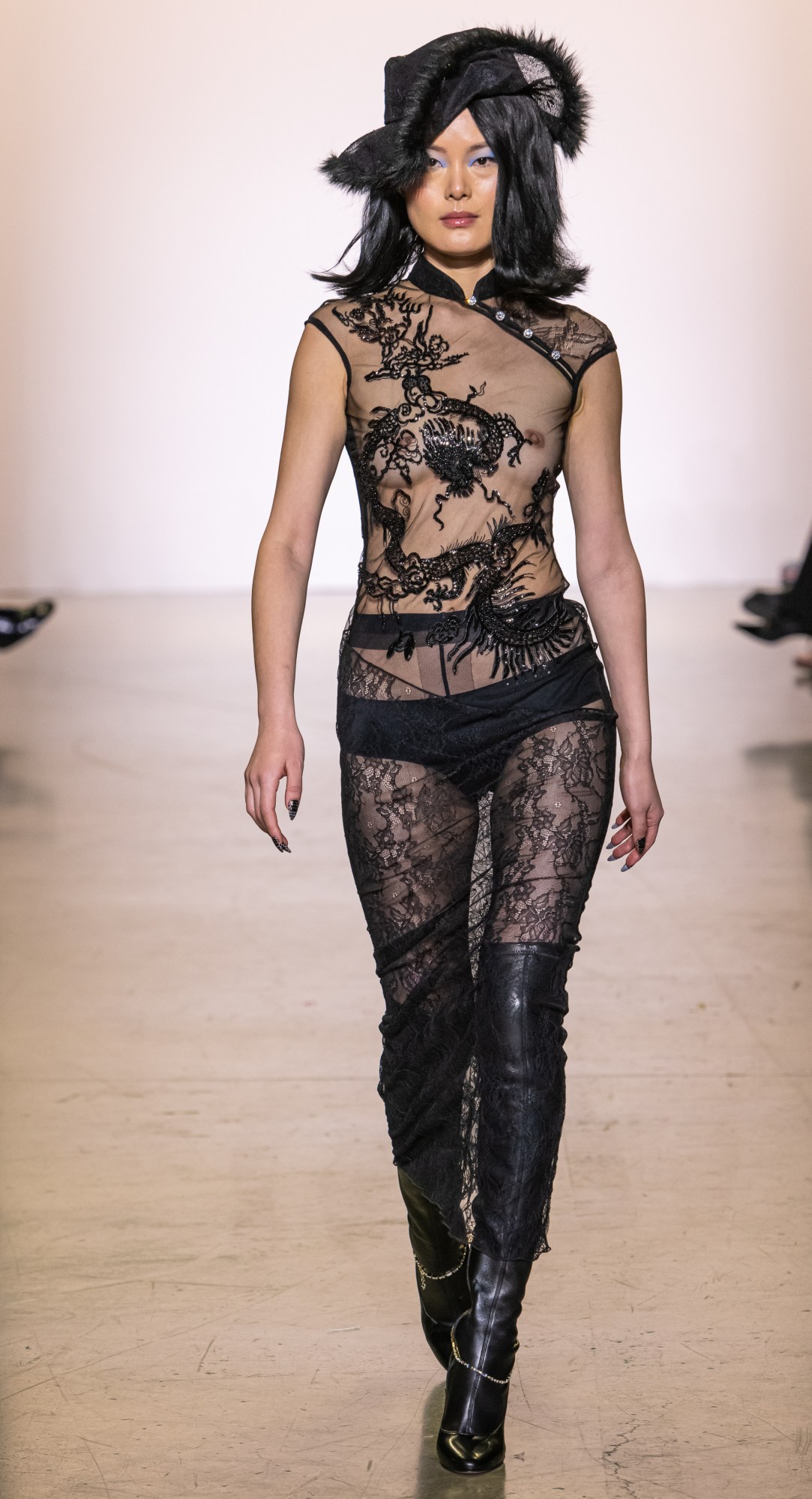 a model walking the runway at kim shui's aw22 show at new york fashion week