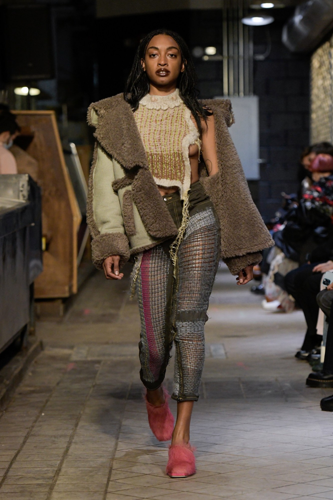 a model walking the runway at eckhaus latta's aw22 show at new york fashion week