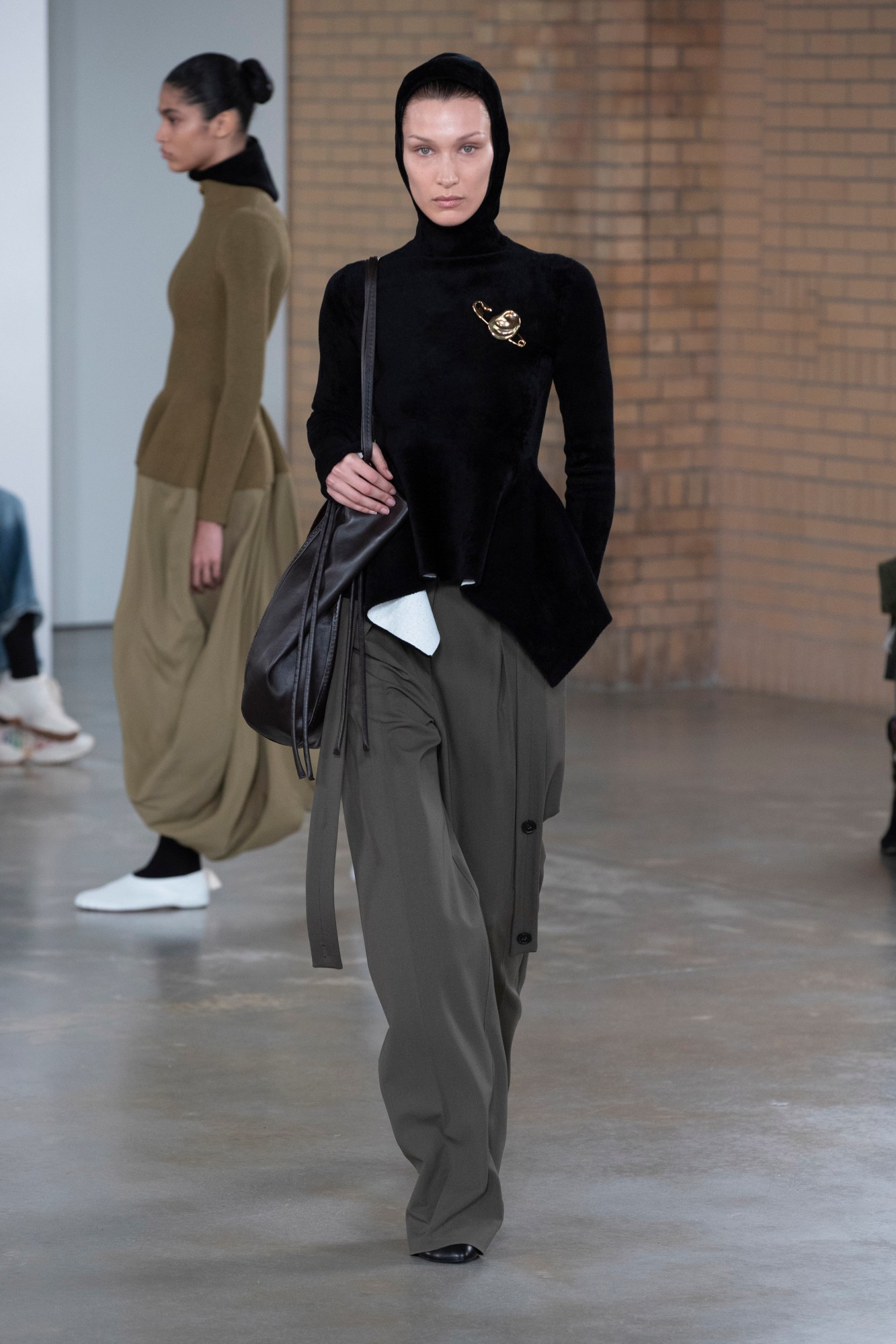 a model walking the runway at proenza schouler's aw22 show at new york fashion week