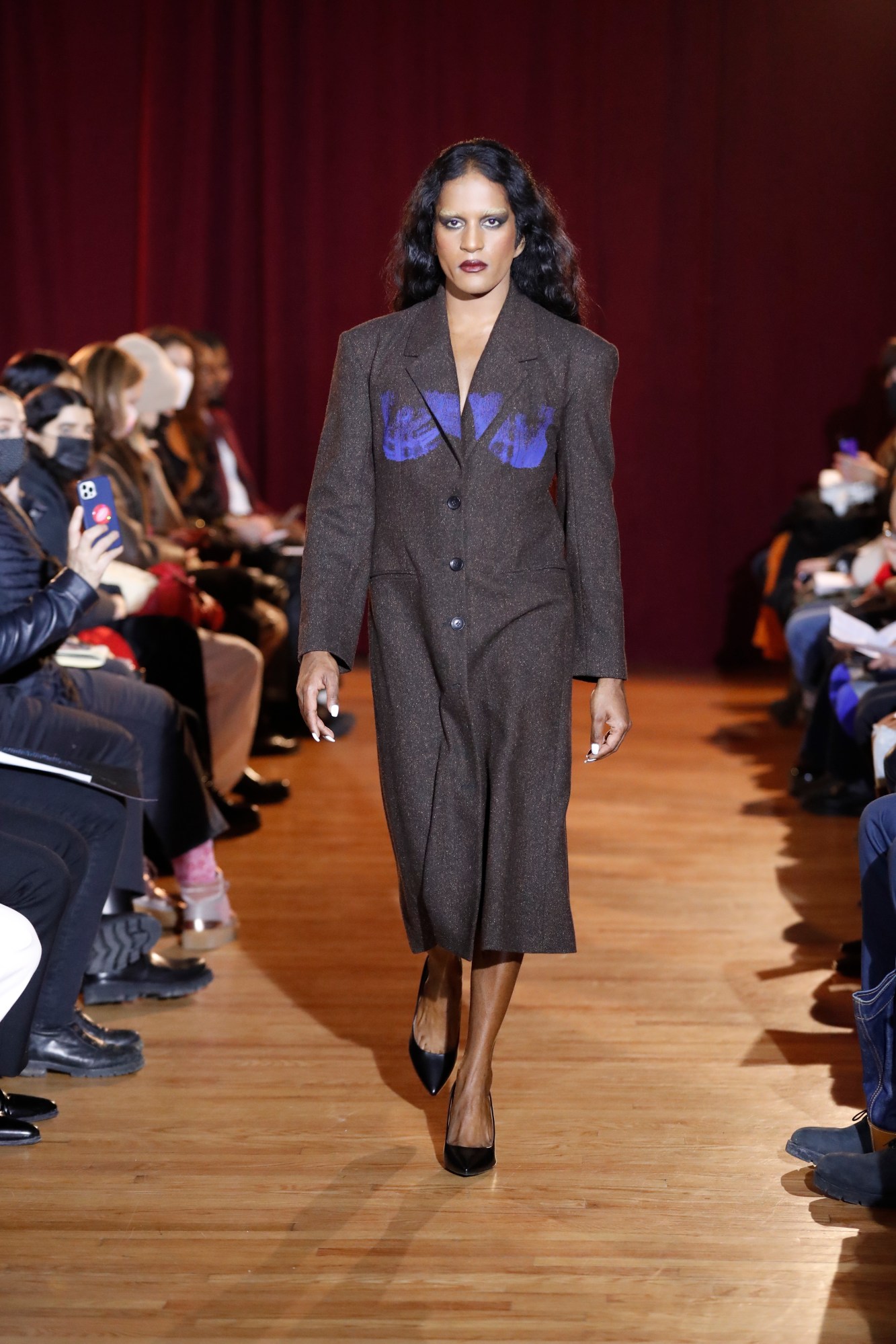 a model walking the runway at puppets and puppets' aw22 show at new york fashion week