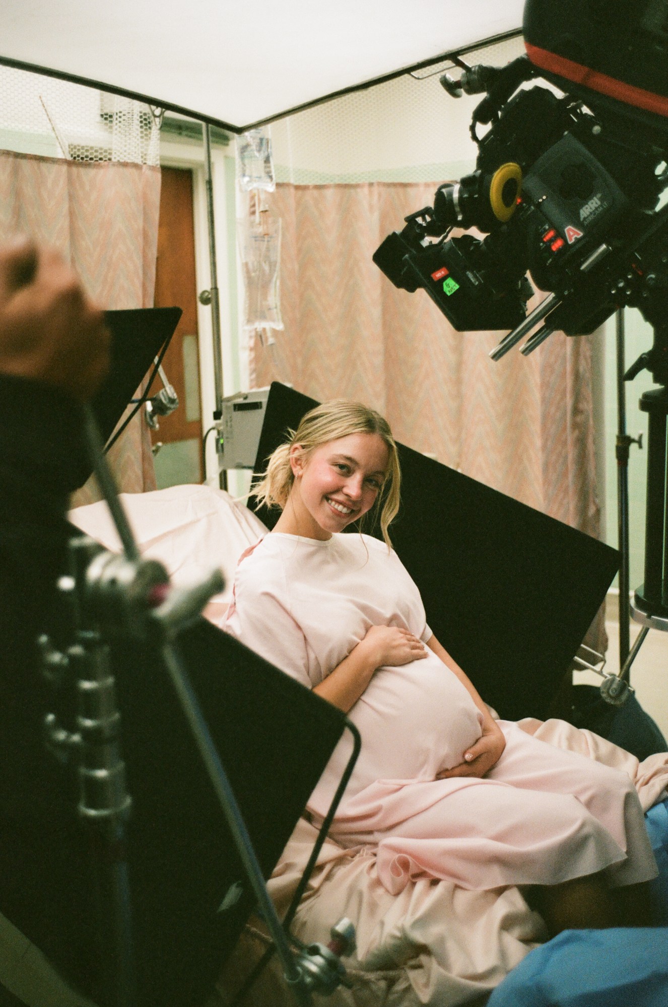 Sydney Sweeney poses with a fake pregnancy belly on the set of Euphoria