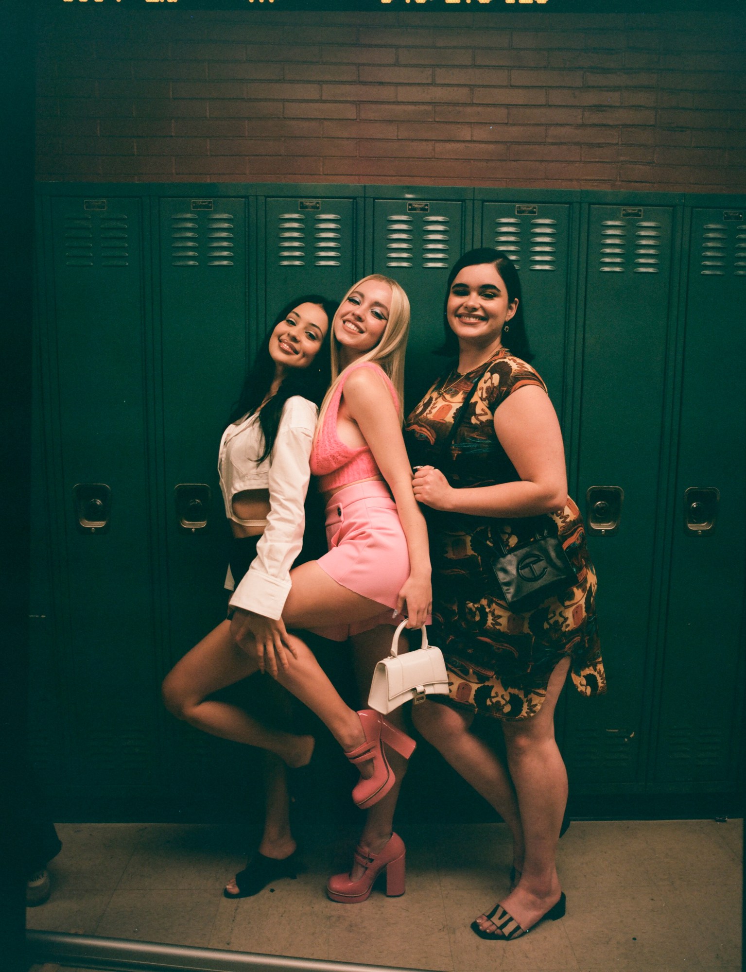 Alexa Demie, Sydney Sweeney and Barbie Ferreira pose against lockers