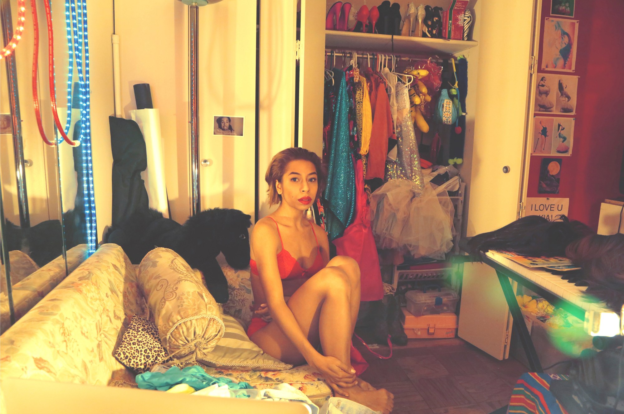 a self-portrait of kia labeija wearing red underwear in her new york bedroom