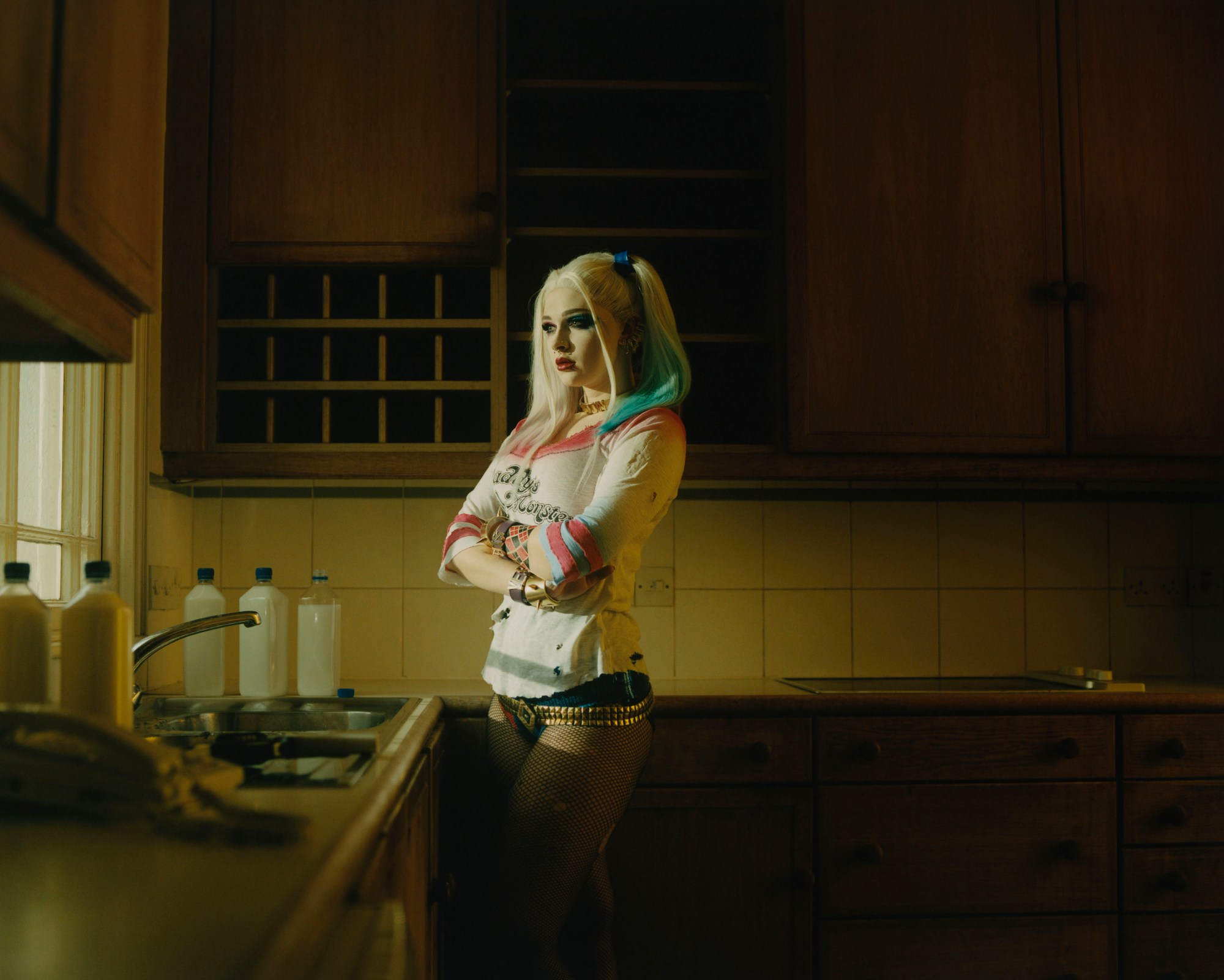 a harley quinn cosplayer in a kitchen