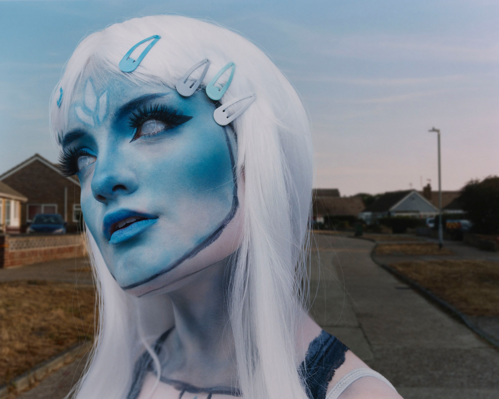 a cosplayer in a suburban street