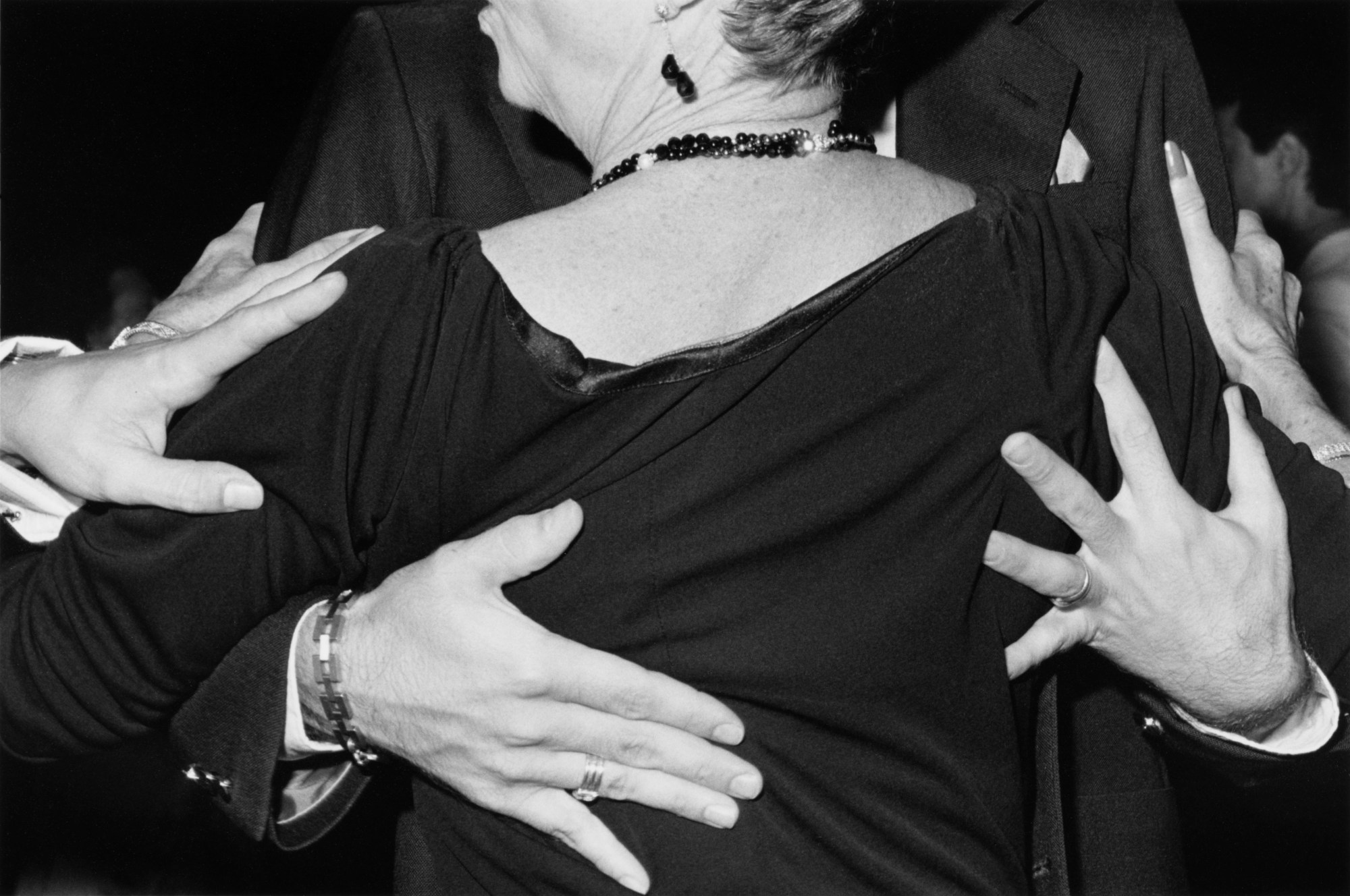 two ballroom dancers captured from behind by ken graves and eva lipman