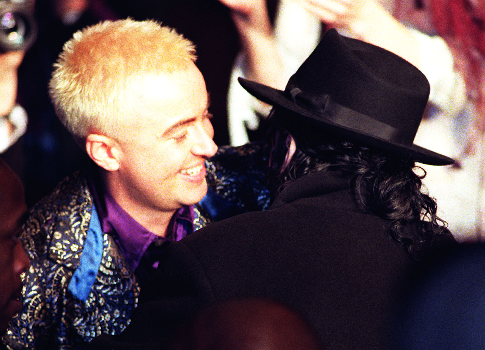 Julien MacDonald seemingly posing with Michael Jackson at his AW98 show